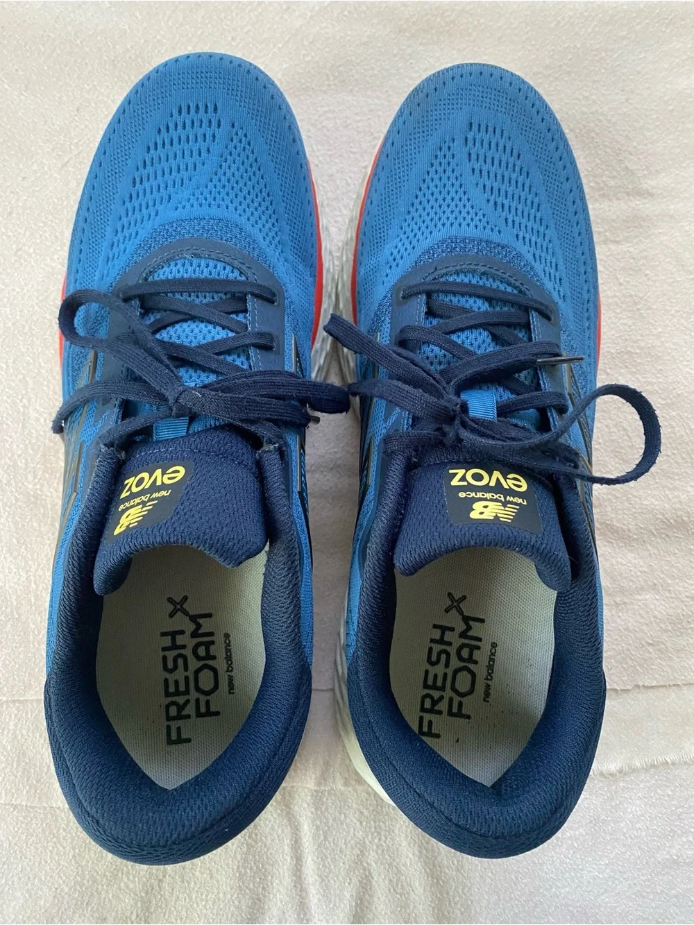 New Balance EvoZ Men's Blue and Navy Athletic Running Shoes with Red Accent